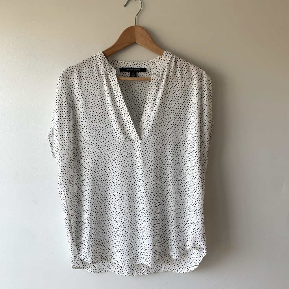 Size medium white with black polka dots, short sleeve blouse